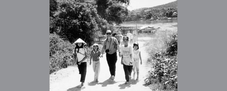 Lon Holmberg accompanied by children to Minh Mang’s tomb